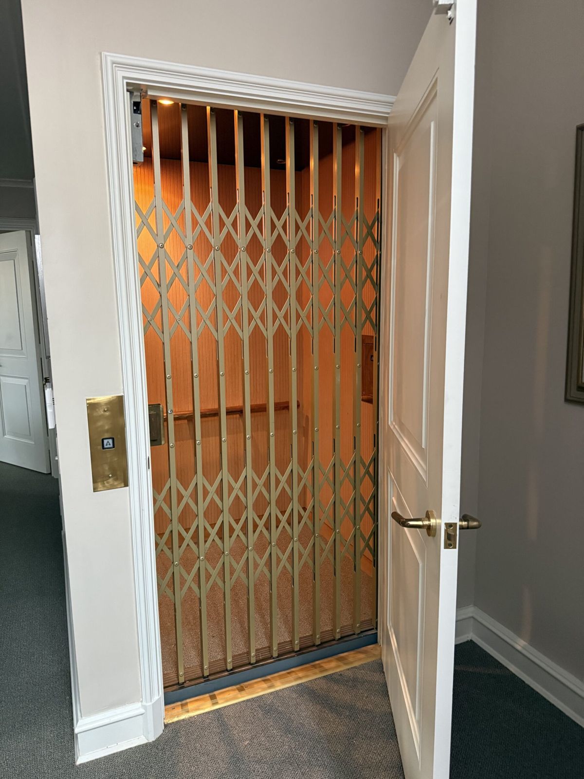 Home elevator with accordion gate