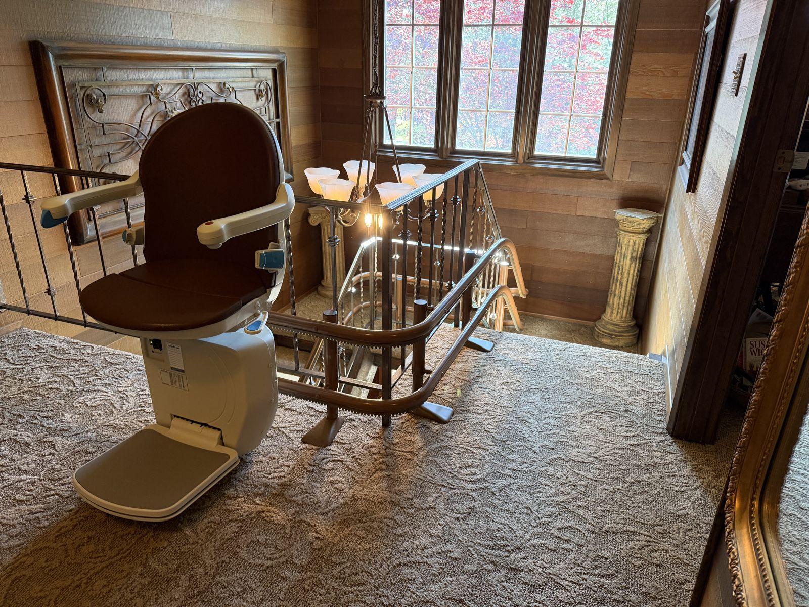 Curved stairlift at an upper landing